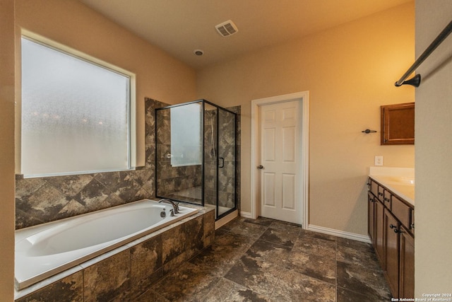 bathroom with shower with separate bathtub and vanity