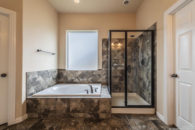 bathroom featuring plus walk in shower