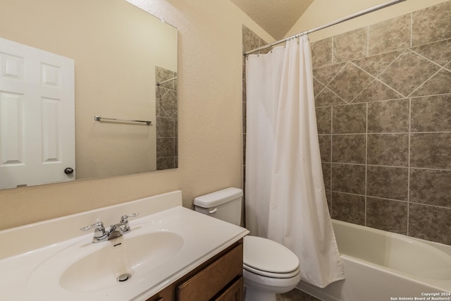 full bathroom featuring vanity, toilet, a textured ceiling, and shower / tub combo