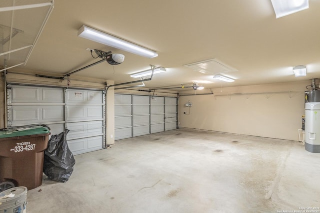 garage featuring a garage door opener and water heater