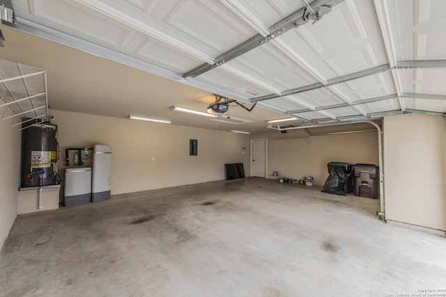 garage featuring electric panel, gas water heater, and a garage door opener