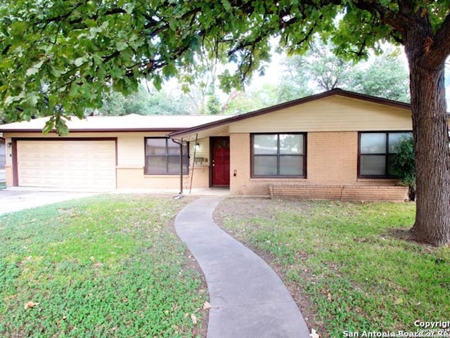 ranch-style house with a garage and a front yard