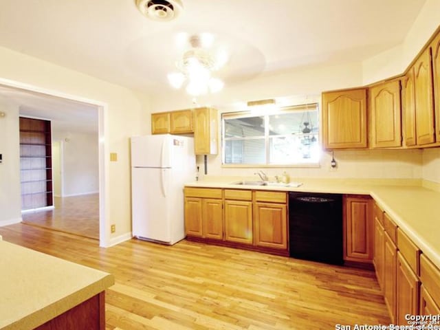 kitchen with light wood-type flooring, ceiling fan, sink, white refrigerator, and dishwasher