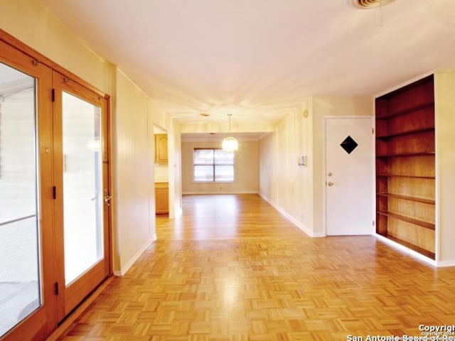 unfurnished room featuring light parquet floors