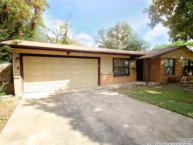 ranch-style house featuring a garage