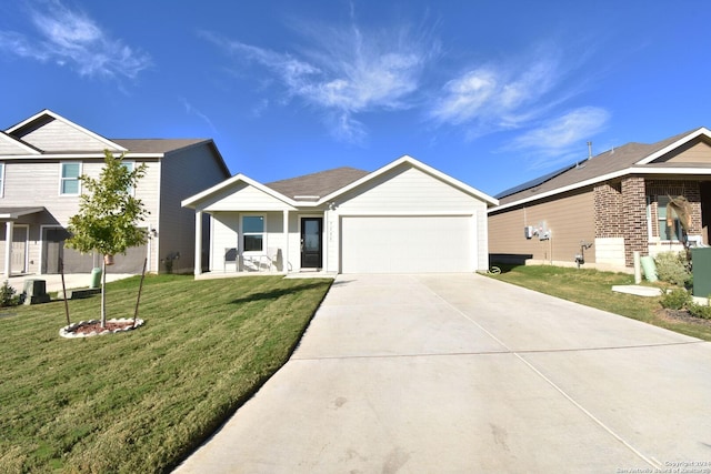 view of front of house featuring a garage and a front yard