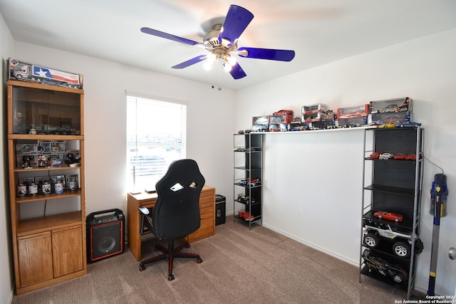 carpeted home office with ceiling fan