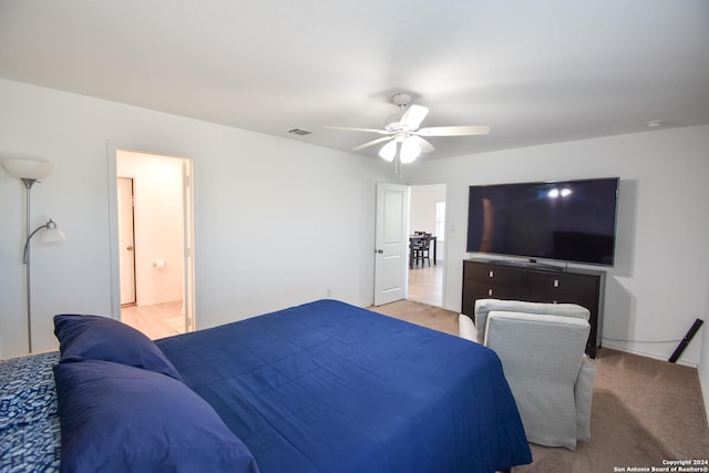 bedroom with connected bathroom and ceiling fan