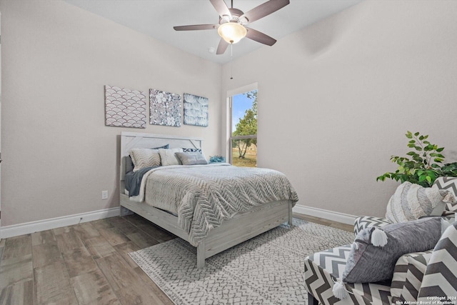 bedroom with hardwood / wood-style flooring and ceiling fan