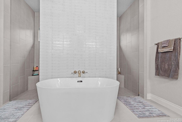 bathroom featuring tile patterned floors and a tub