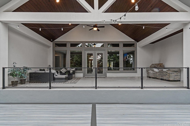 wooden deck with an outdoor hangout area and ceiling fan