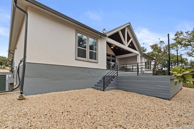 rear view of property featuring cooling unit