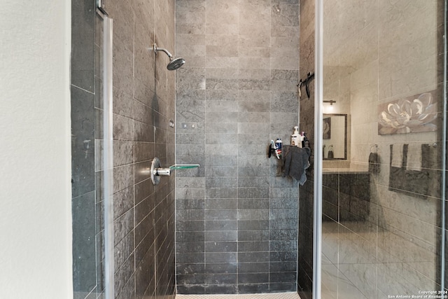 bathroom with tiled shower