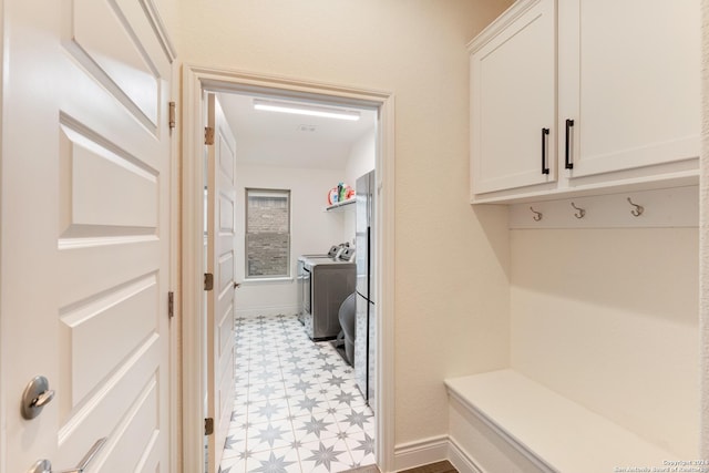 mudroom with washing machine and clothes dryer