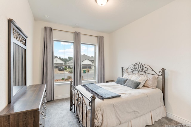 bedroom with light carpet