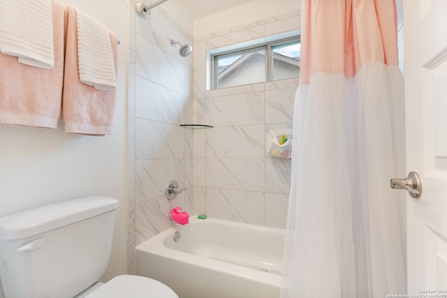 bathroom with shower / bath combination with curtain and toilet