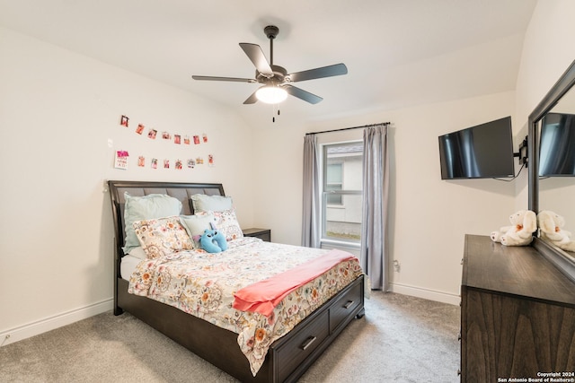 bedroom with ceiling fan and light colored carpet