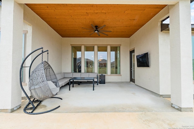 view of patio with ceiling fan and an outdoor living space