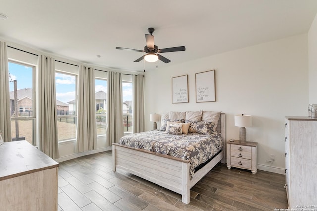 bedroom featuring ceiling fan and dark hardwood / wood-style floors