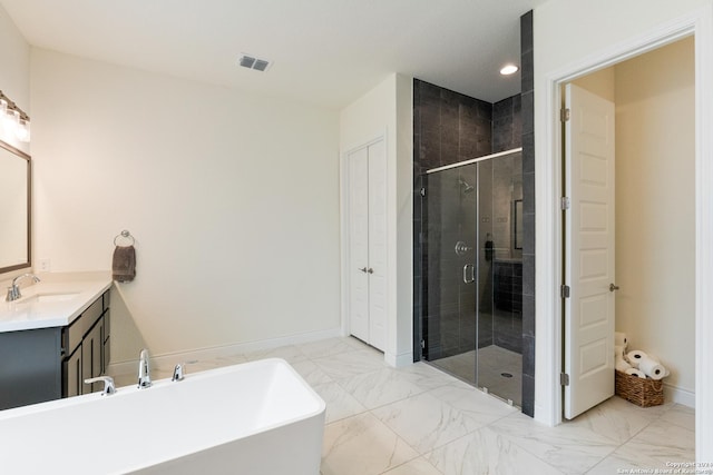 bathroom featuring vanity and shower with separate bathtub