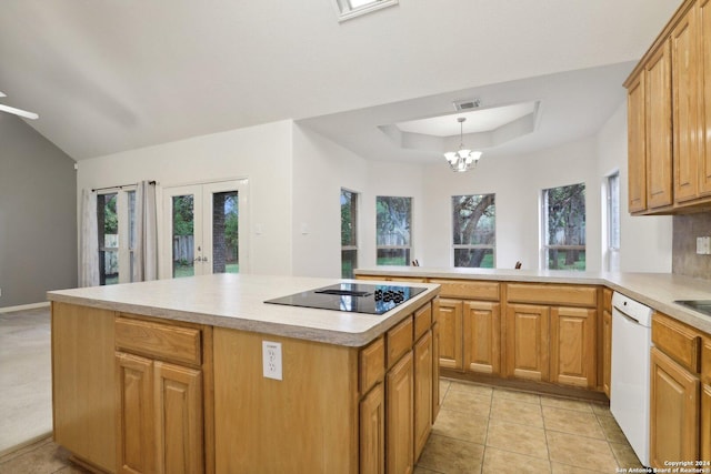 kitchen with french doors, black electric cooktop, an inviting chandelier, dishwasher, and a center island