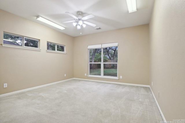 carpeted empty room with ceiling fan