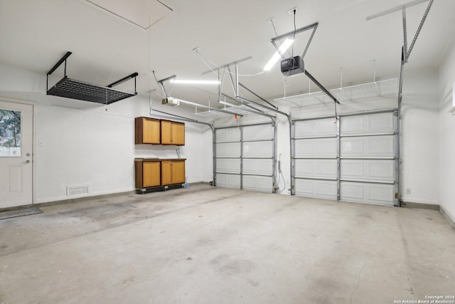 garage featuring a garage door opener