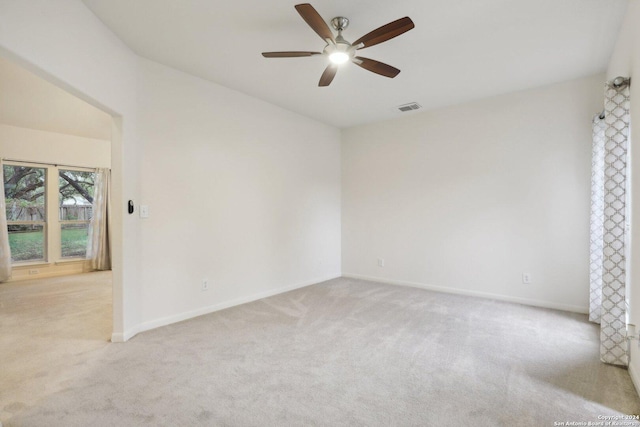 carpeted empty room with ceiling fan