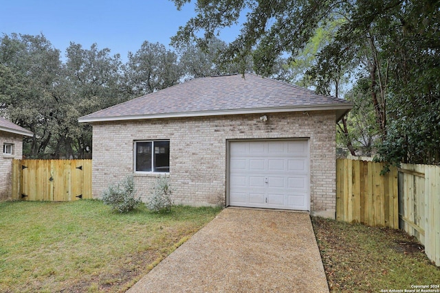 garage featuring a yard