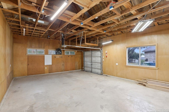 garage featuring wooden walls