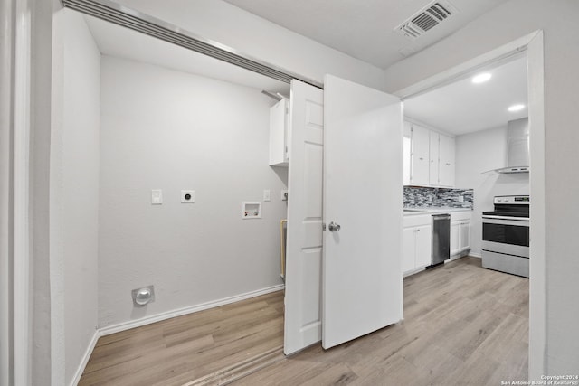 laundry area with electric dryer hookup, light hardwood / wood-style floors, and hookup for a washing machine