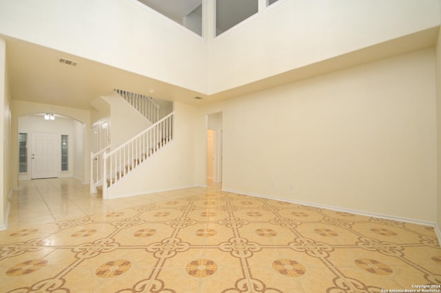 interior space with a towering ceiling