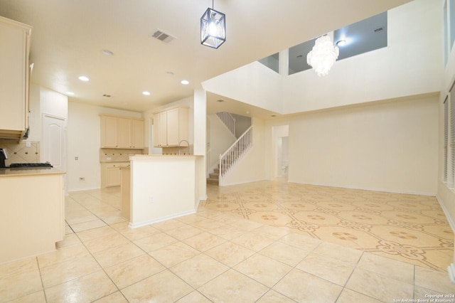 kitchen with decorative backsplash and light tile patterned floors