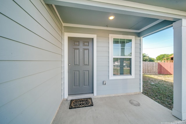 doorway to property featuring covered porch