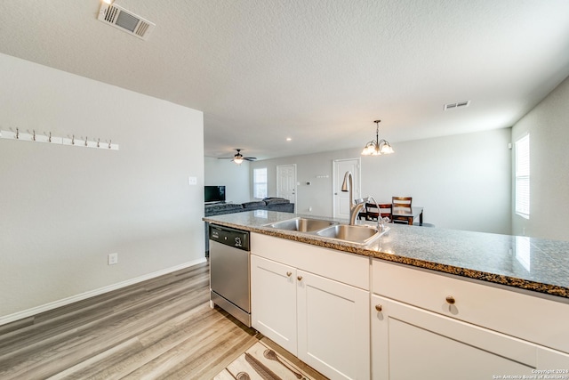 kitchen featuring light hardwood / wood-style floors, stainless steel dishwasher, a healthy amount of sunlight, and sink