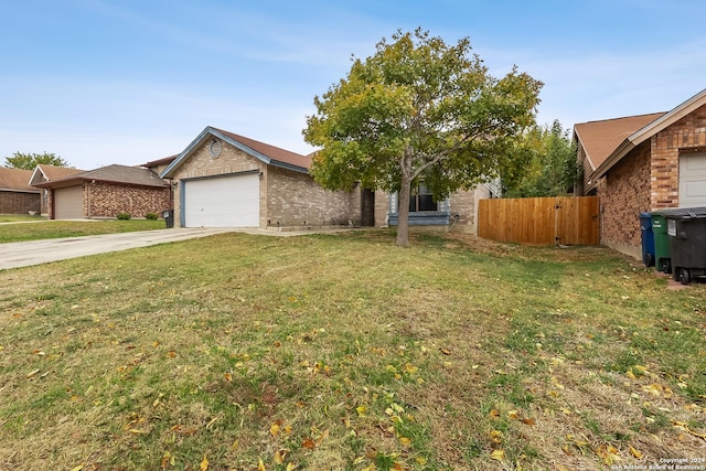 view of front of property with a garage and a front yard