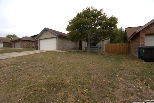 view of front of home with a garage and a front yard