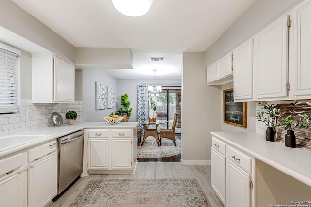 kitchen featuring white cabinetry, dishwasher, and light hardwood / wood-style floors