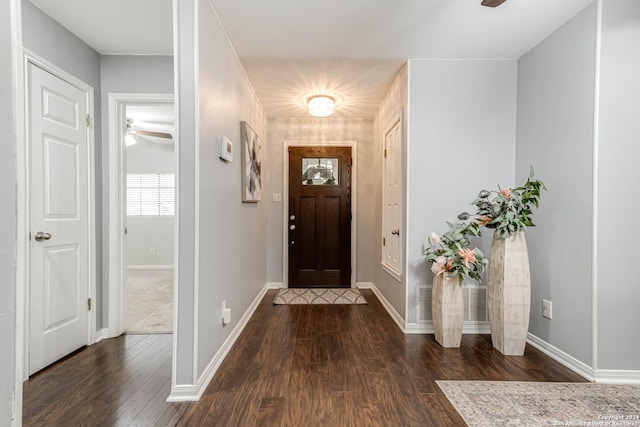 entrance foyer featuring ceiling fan and dark wood-type flooring