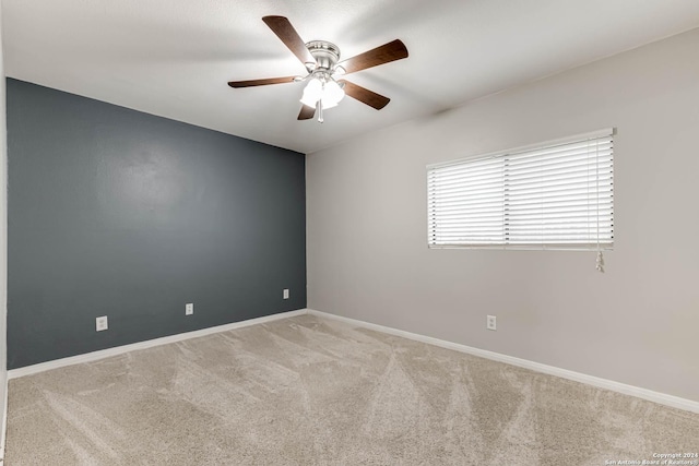 empty room with light carpet and ceiling fan