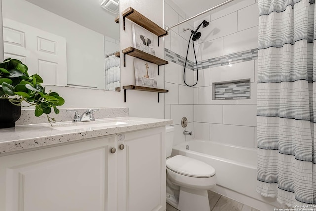 full bathroom with vanity, toilet, and shower / bath combo