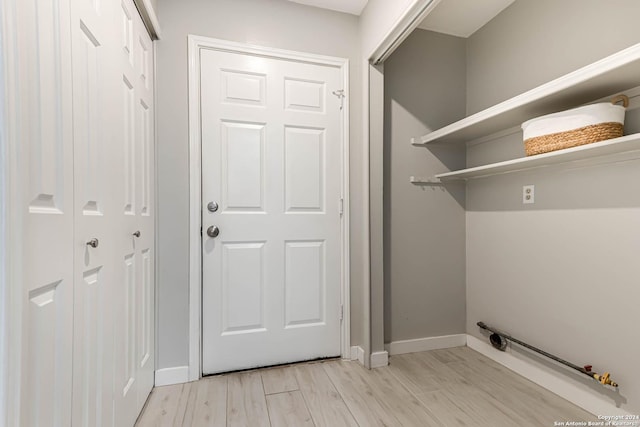 washroom with light hardwood / wood-style flooring