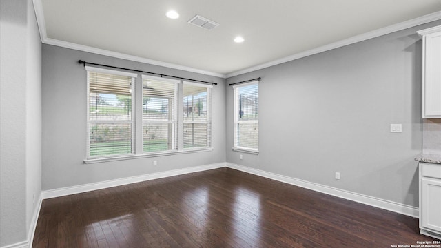 unfurnished room featuring dark hardwood / wood-style flooring and ornamental molding