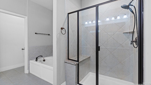 bathroom featuring tile patterned floors and independent shower and bath