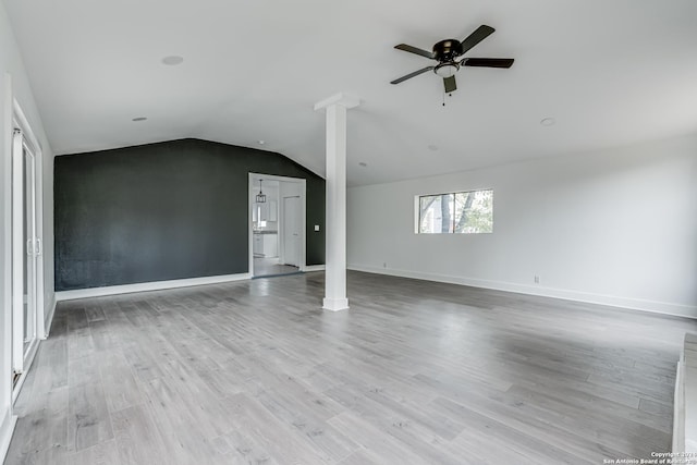 unfurnished living room featuring light hardwood / wood-style floors, ceiling fan, and lofted ceiling