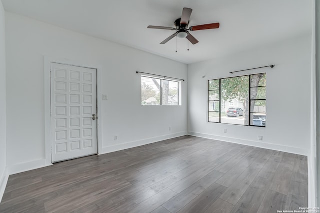 unfurnished room with ceiling fan and hardwood / wood-style floors