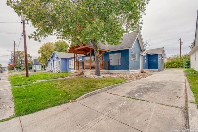 bungalow with a front yard