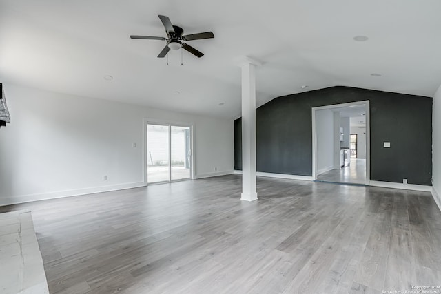 spare room with ceiling fan, light hardwood / wood-style floors, and lofted ceiling