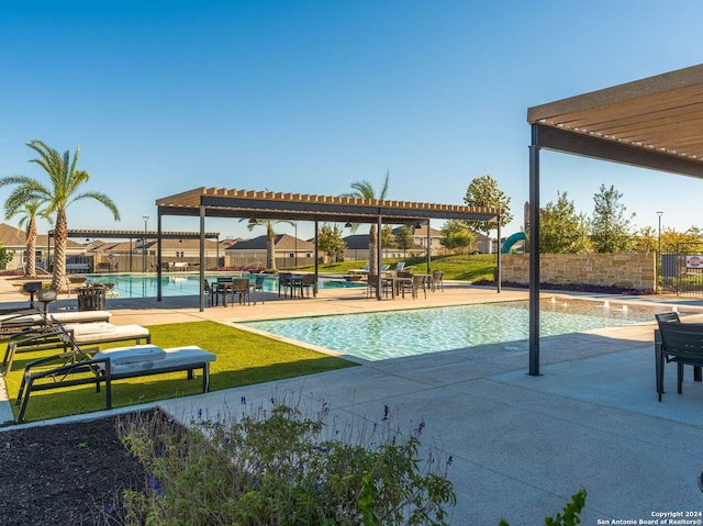 view of pool featuring a patio area and a pergola