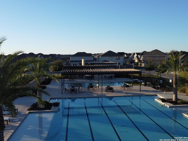 view of swimming pool with a pergola and a patio